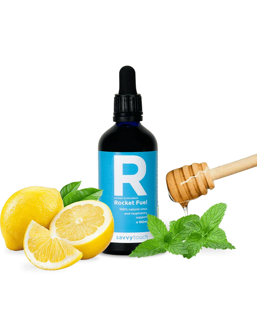 100ml bottle of Savvy Touch Rocket Fuel natural sinus and respiratory support dietary supplement, surrounded by fresh lemons, mint leaves, and a honey dipper with dripping honey.